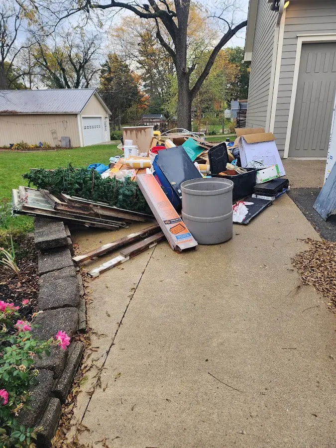 Dumpster being loaded with debris for Estate Cleanout Dumpster Rental in Glassmanor